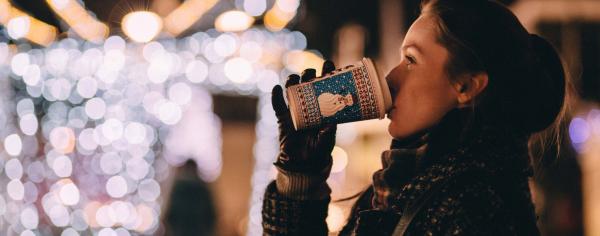 Student in festive setting drinking coffee
