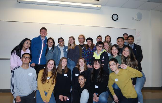 A photograph of the members of UBC Best Buddies in a classroom.