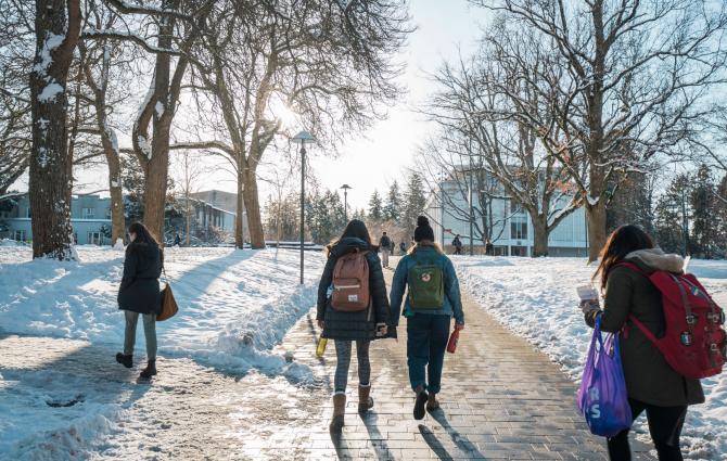 Students walking around the UBC campus in the snow