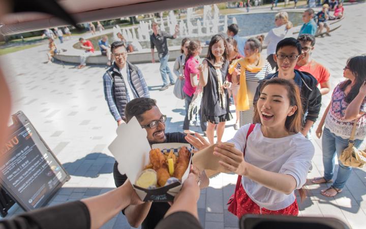 Students ordering lunch from a food truck at UBC Vancouver