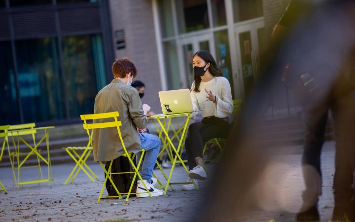 A student conducting an information interview outdoors at UBC 