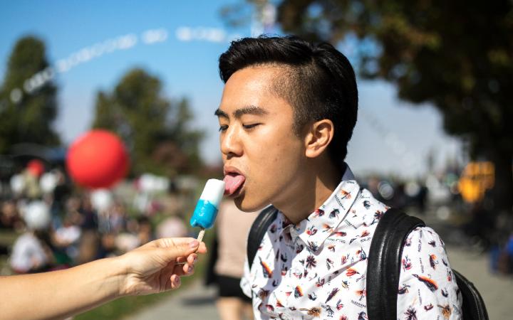 student licking popsicle 